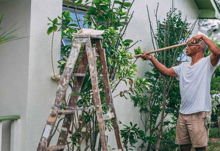 Picture of man working outside the house