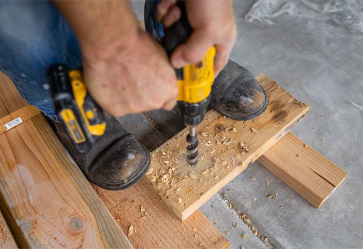 Carpenter Drilling Wood